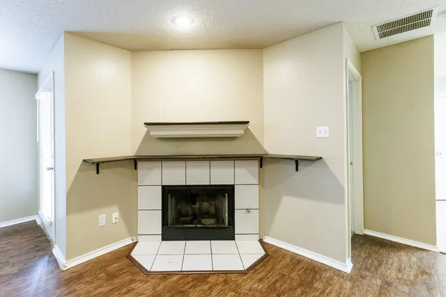 a kitchen with a refrigerator sink and cabinets