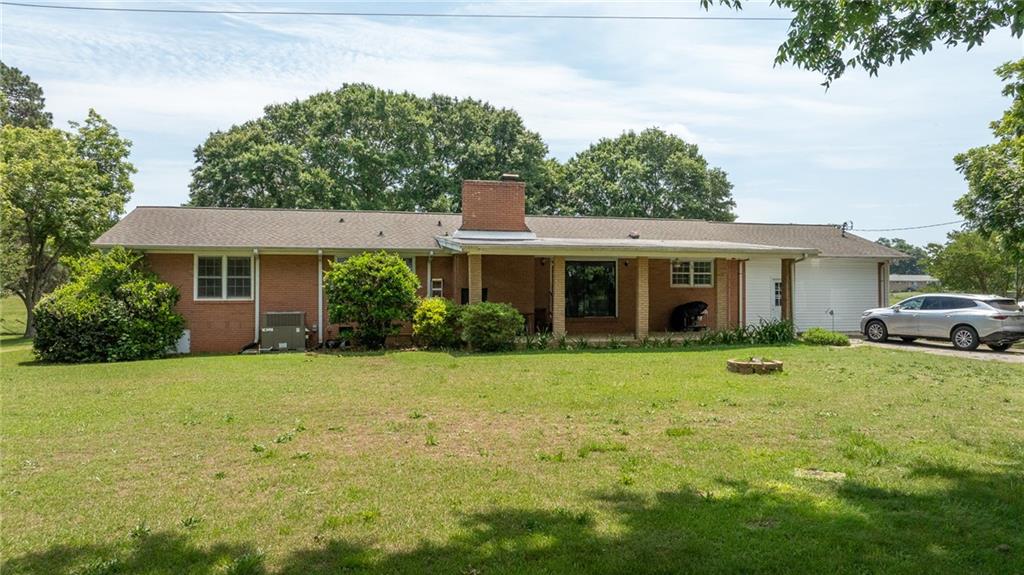 570 Wildcat Bridge Road Royston, GA 30662 - Photo 24 of 29 a front view of a house with a yard