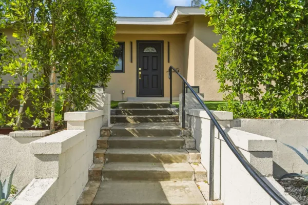 a view of stairs and yard