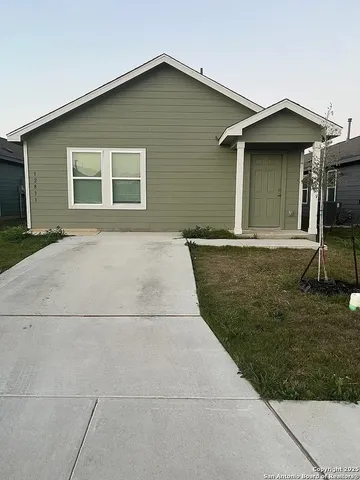 a house with yard in front of it