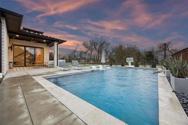 a view of outdoor space with swimming pool and furniture