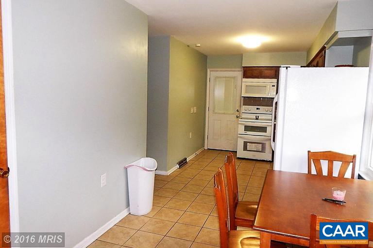 1822 James City Road Reva, VA 22735 - Photo 4 of 11 a view of a kitchen with refrigerator and a stove