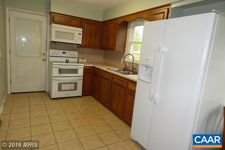 1822 James City Road Reva, VA 22735 - Photo 5 of 11 a kitchen with stainless steel appliances a sink and a refrigerator