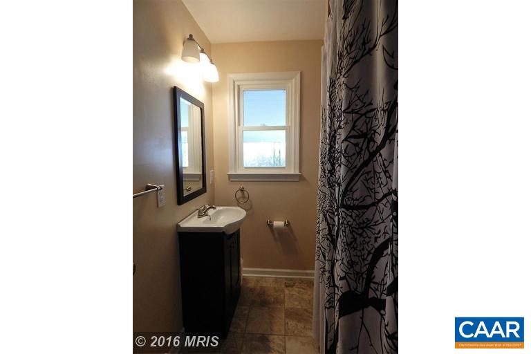 1822 James City Road Reva, VA 22735 - Photo 6 of 11 a bathroom with a sink and a mirror