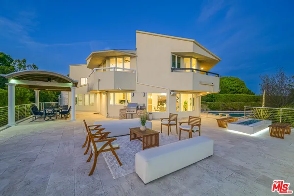 a view of a patio with swimming pool table and chairs