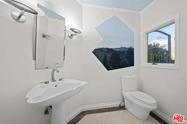 a bathroom with a granite countertop sink a toilet and bathtub