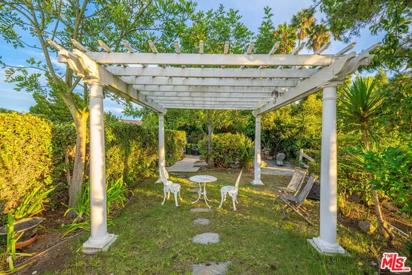 a view of a balcony with an outdoor seating