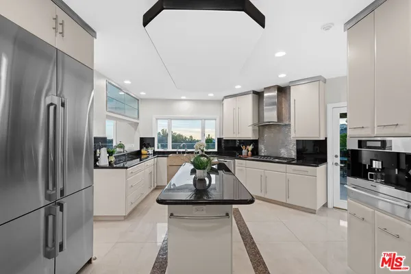 a view of a balcony next to a yard