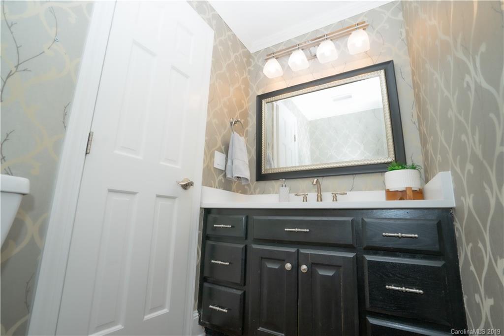3256 Gray Moss Road Charlotte, NC 28270 - Photo 8 of 35 a bathroom with a sink a vanity and a mirror