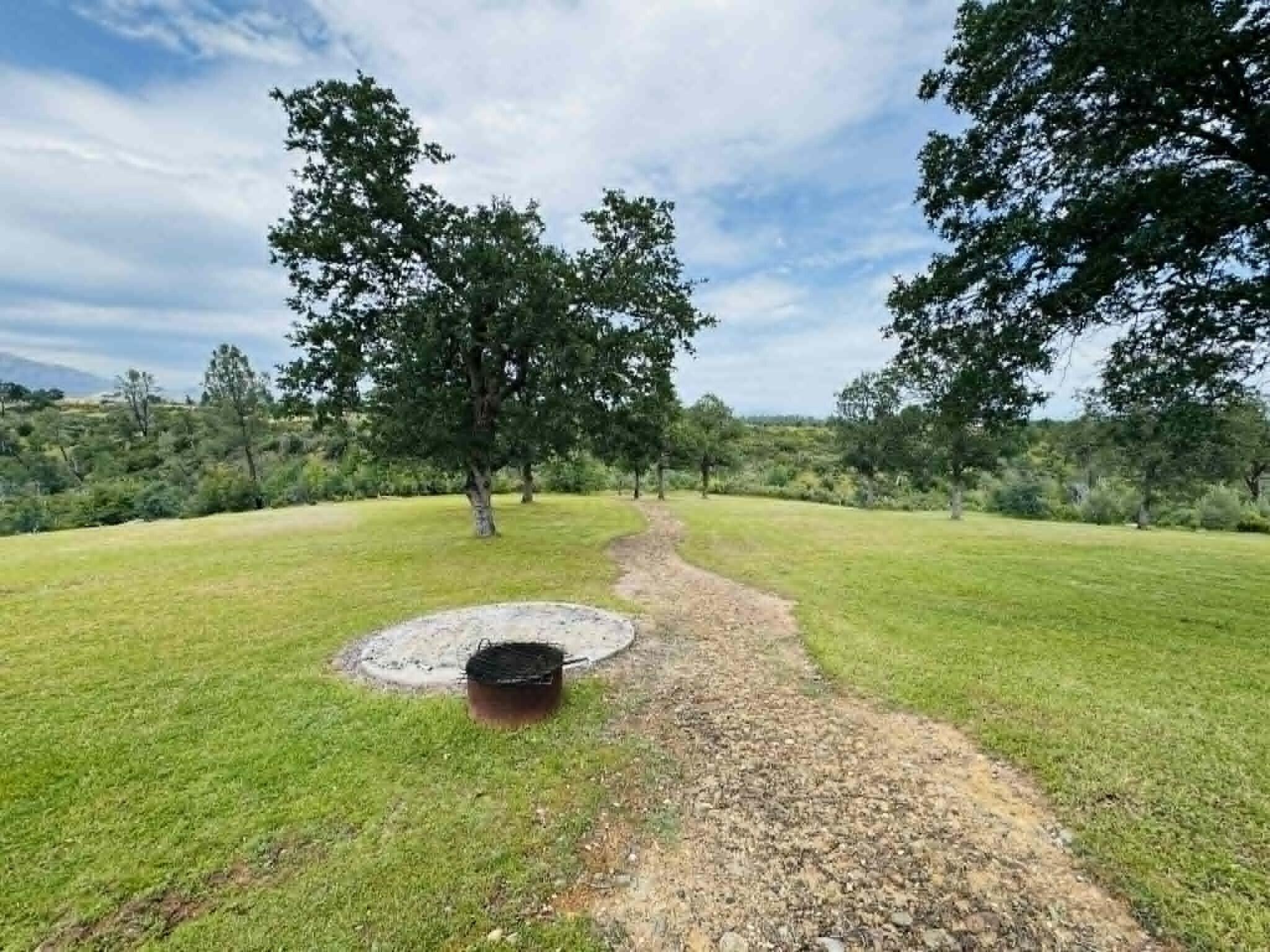 6231 Ridgetop Road Anderson, CA 96007 - Photo 44 of 49 a view of a lake with a yard