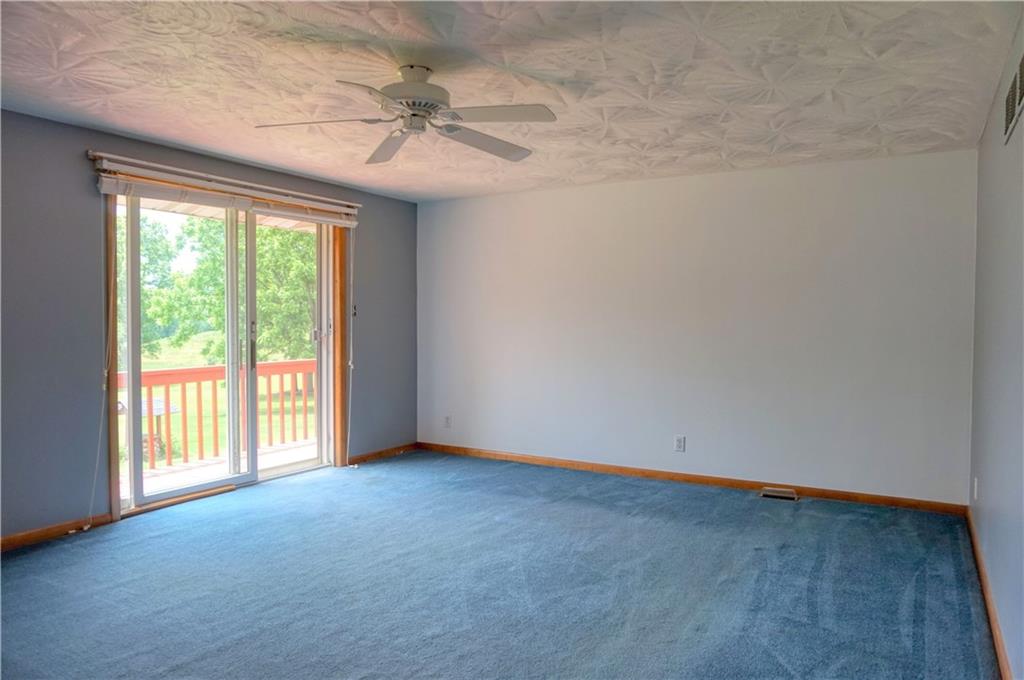 128 West Liberty Road Slippery Rock, PA 16057 - Photo 14 of 25 Living area in the addition with sliding door to the connecting rear deck!