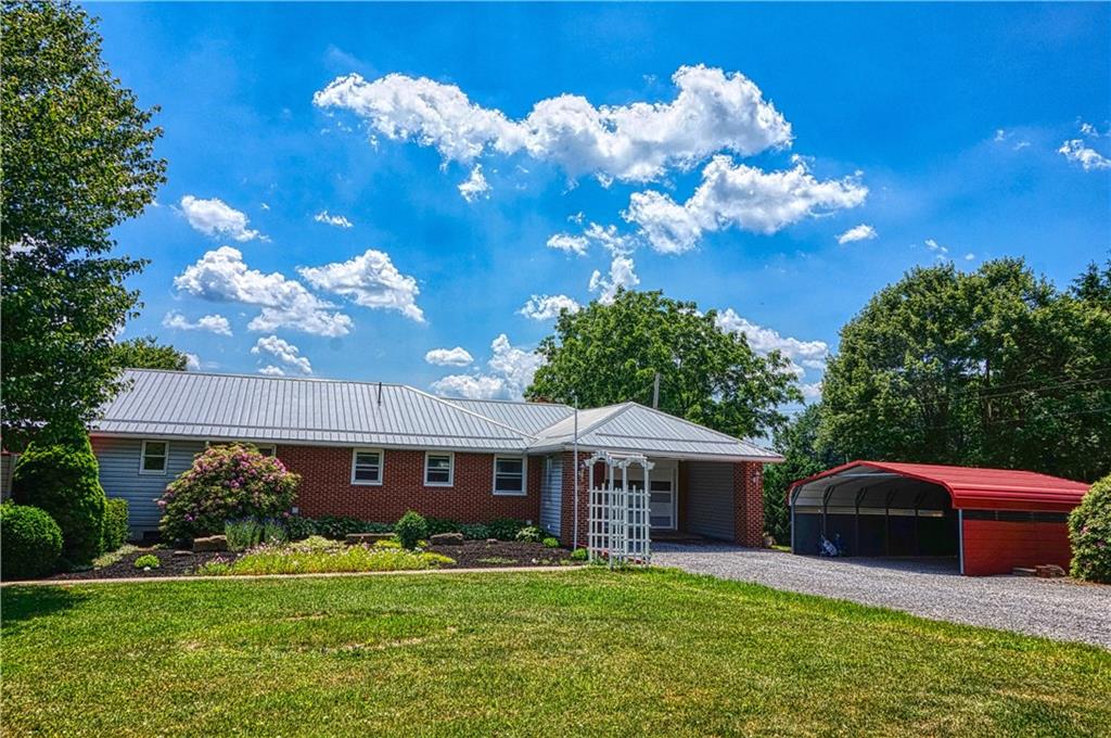 128 West Liberty Road Slippery Rock, PA 16057 - Photo 3 of 25 The original home is brick and the addition is vinyl sided with a brand new metal roof!