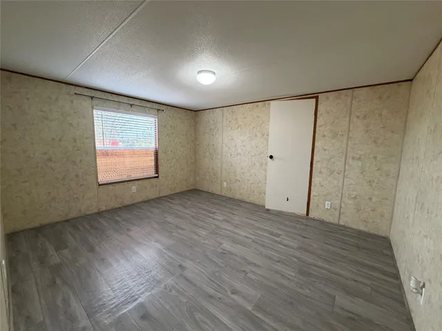 a bathroom with a toilet and shower