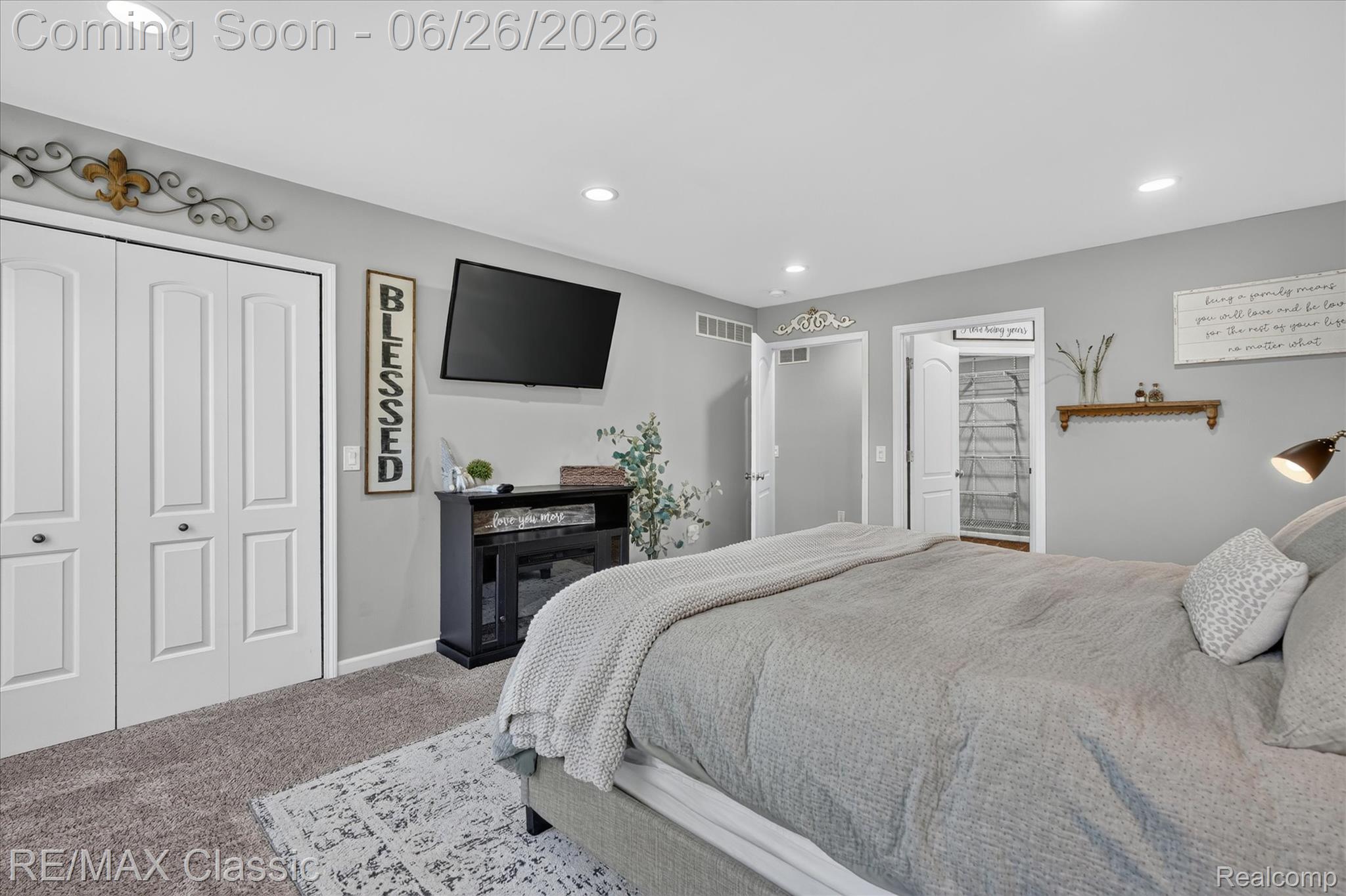 3205 North Milford Road Highland, MI 48357 - Photo 18 of 53 Carpeted bedroom featuring recessed lighting and a built-in electric fireplace