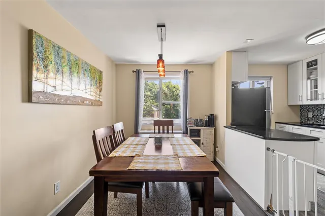 a view of a dining room with furniture window and wooden floor