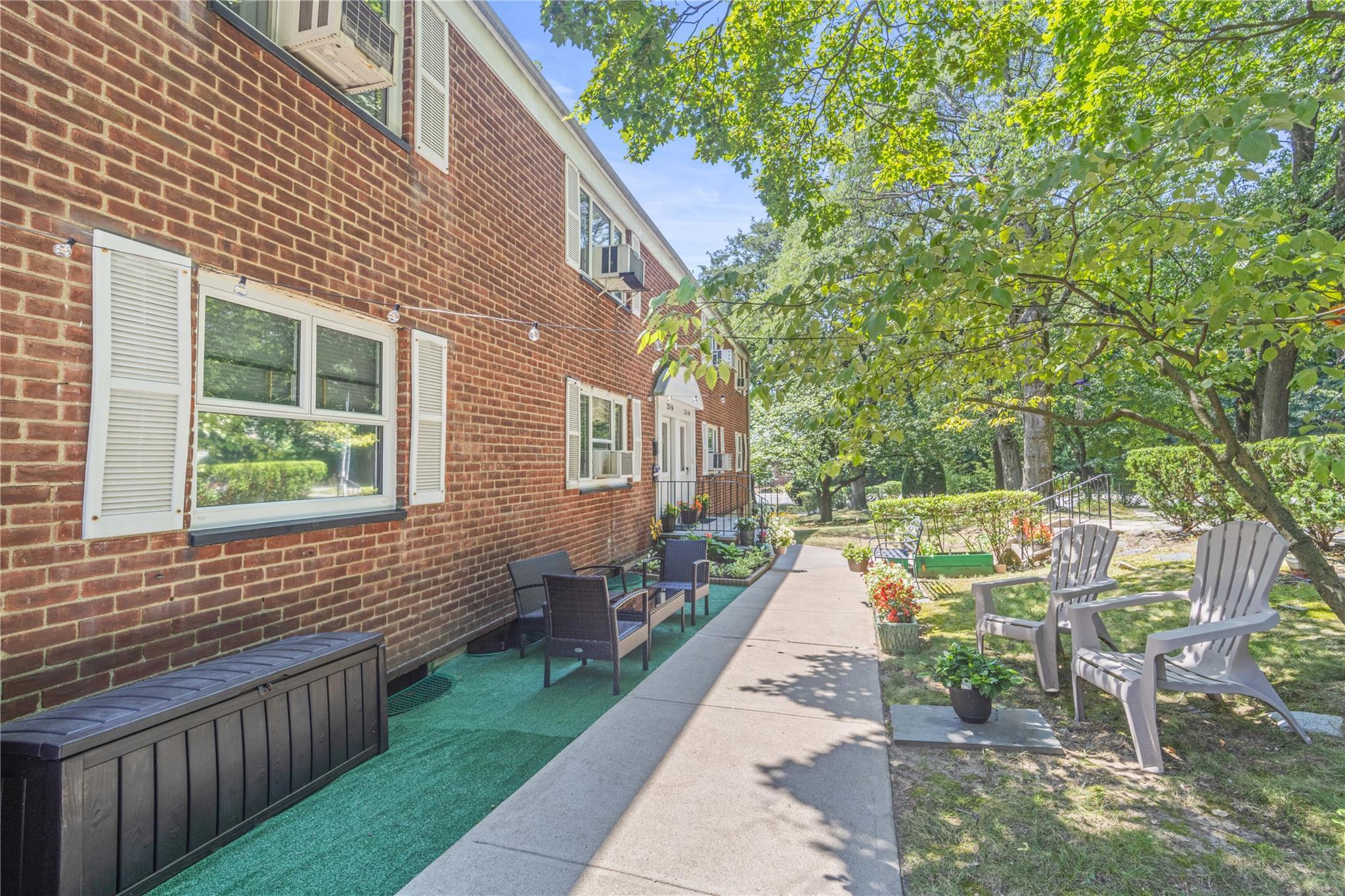220-06 Stronghurst Avenue, Unit LOWR Queens, NY 11427 - Photo 18 of 19 a view of a backyard with sitting area