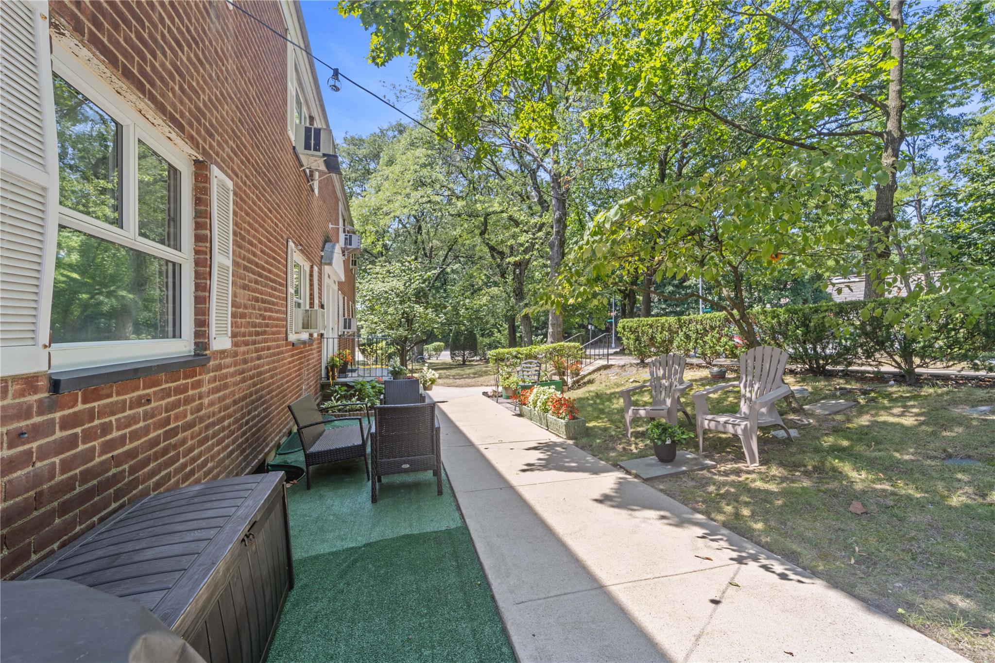220-06 Stronghurst Avenue, Unit LOWR Queens, NY 11427 - Photo 19 of 19 a view of a backyard with sitting area