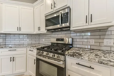 a bathroom with a sink vanity and a mirror