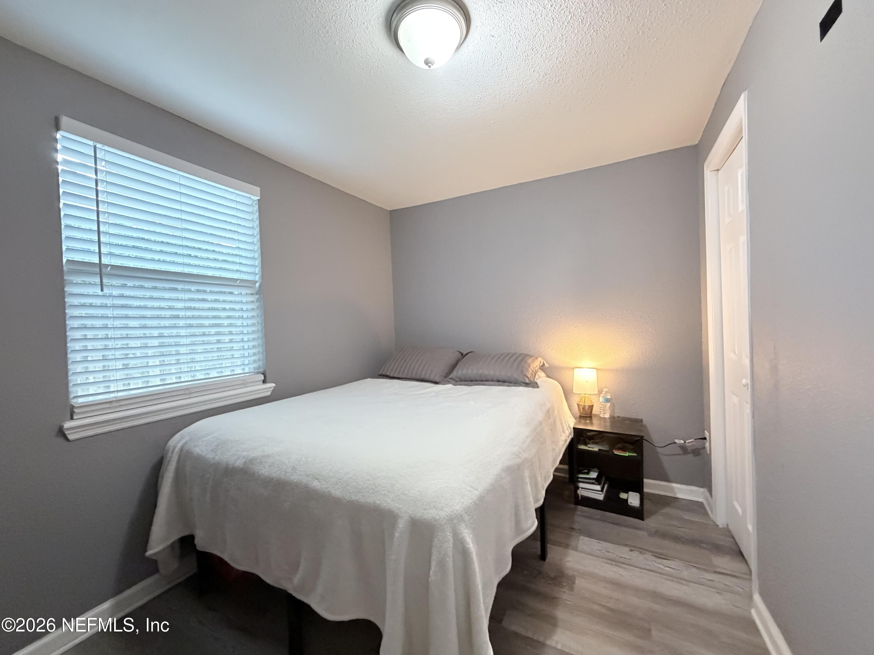 5336 Cruz Road Jacksonville, FL 32207 - Photo 29 of 29 a bedroom with a bed and a window