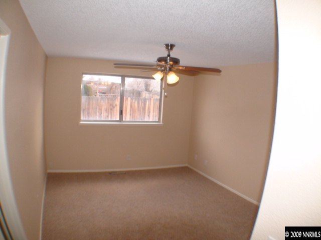 13081 Exinite Drive Reno, NV 89506 - Photo 7 of 9 an empty room with a window