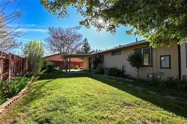 a view of a house with a yard