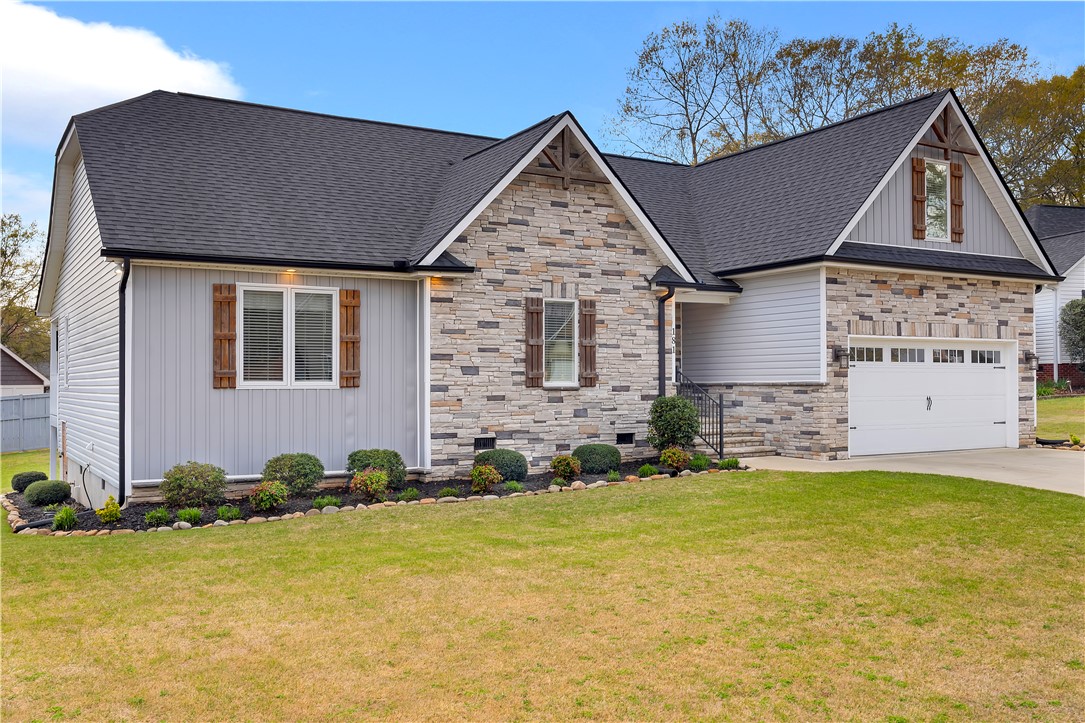 181 Amberwood Drive Anderson, SC 29621 - Photo 2 of 28 This inviting home features a charming exterior with stone accents and a well-maintained lawn.