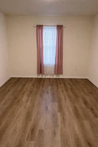 a view of an empty room and window