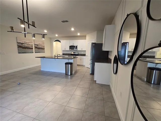 a kitchen with a sink and a microwave