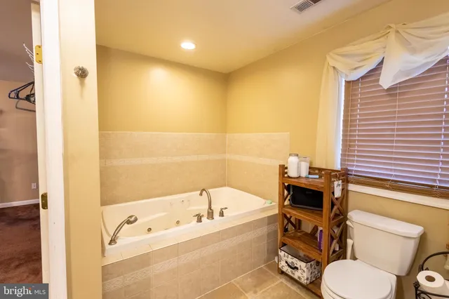 a bathroom with a bathtub sink and toilet