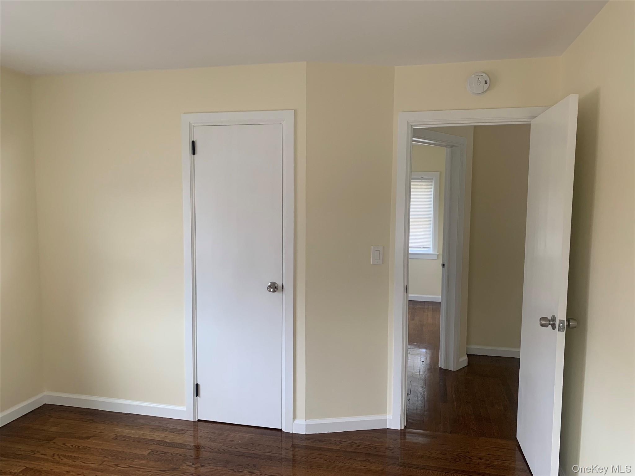 711 North Division Street Peekskill, NY 10566 - Photo 14 of 21 a view of an empty room with wooden floor