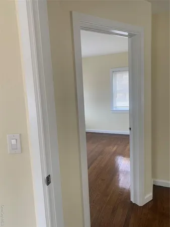 a view of a small space with wooden floor