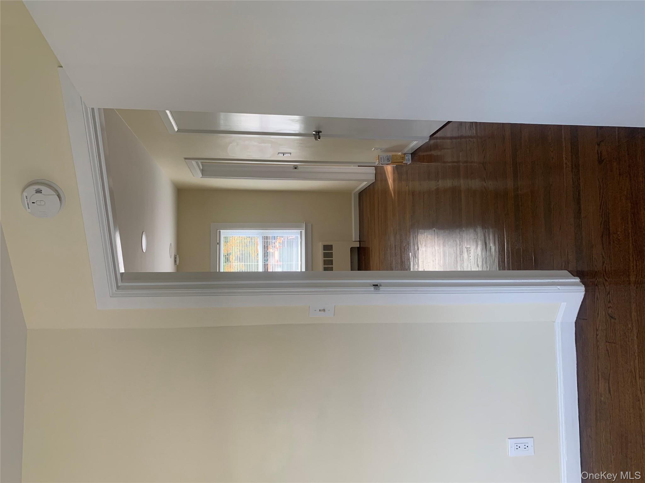 711 North Division Street Peekskill, NY 10566 - Photo 17 of 21 a view of a room with wooden floor and a staircase