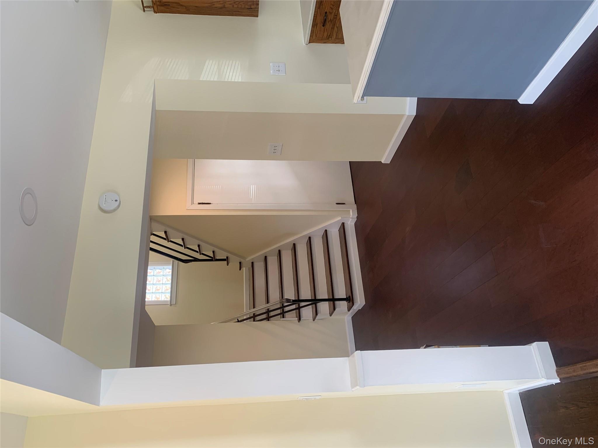 711 North Division Street Peekskill, NY 10566 - Photo 9 of 21 a view of an empty room with wooden floor and a window