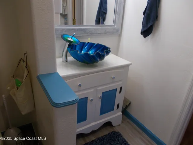 a white toilet sitting next to a shower