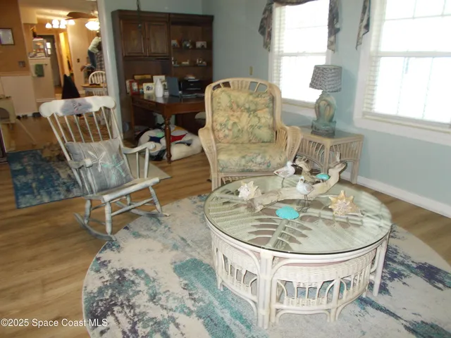 a living room with furniture and a table