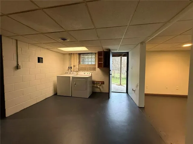 a view of a kitchen with a sink and dishwasher