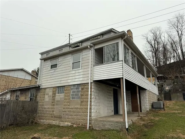 a front view of a house with a garage