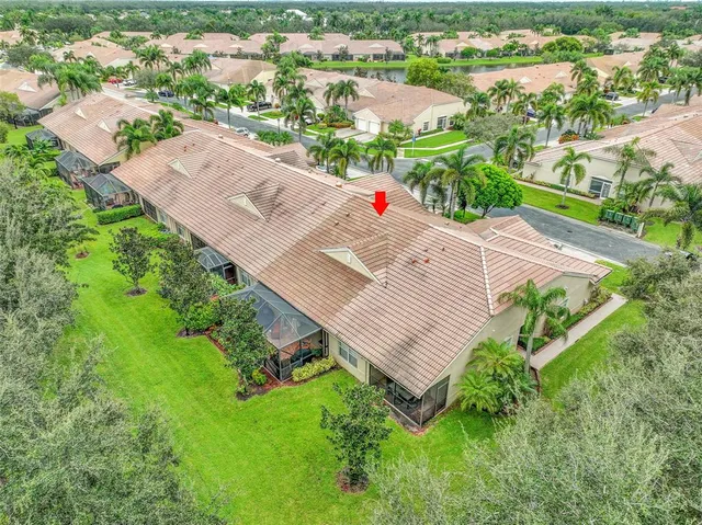 an aerial view of a house with a yard
