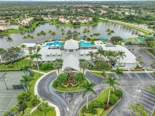 an aerial view of house with yard swimming pool and outdoor seating