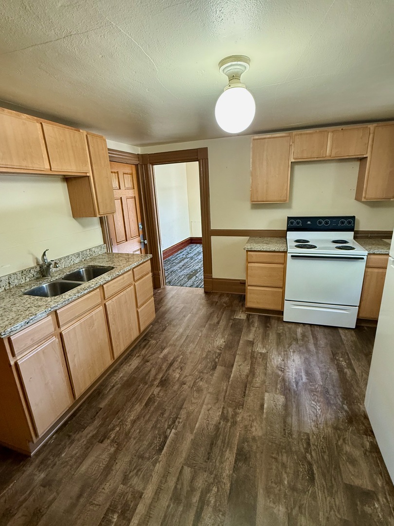 913 West 4th Street Dixon, IL 61021 - Photo 6 of 8 a kitchen with sink and cabinets