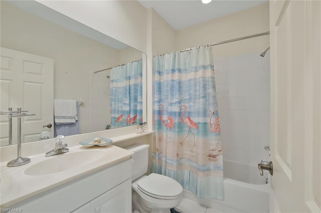 8457 Radcliffe Terrace, Unit 102 Naples, FL 34120 - Photo 19 of 33 Full bathroom featuring vanity and shower / tub combo