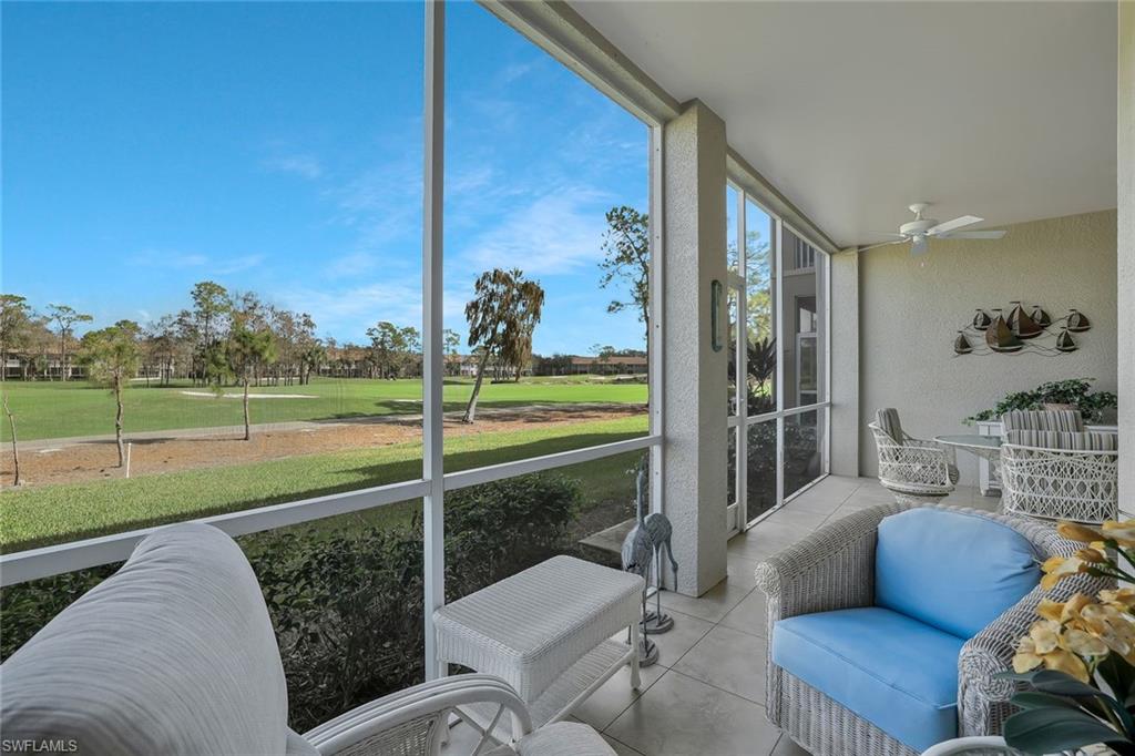 8457 Radcliffe Terrace, Unit 102 Naples, FL 34120 - Photo 21 of 33 Sunroom / solarium with a ceiling fan and view of golf course