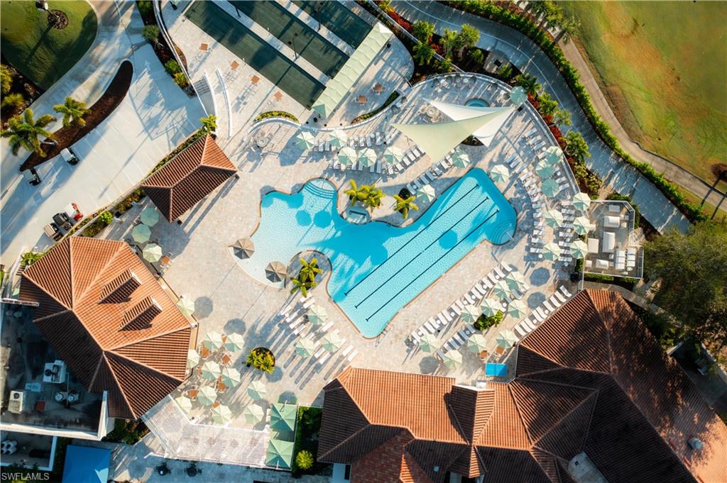 8457 Radcliffe Terrace, Unit 102 Naples, FL 34120 - Photo 27 of 33 Drone / aerial view of a pool area