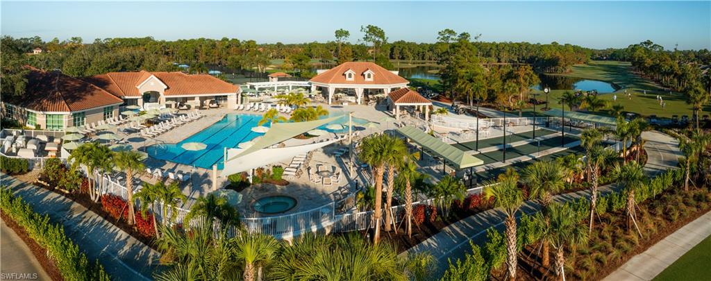 8457 Radcliffe Terrace, Unit 102 Naples, FL 34120 - Photo 31 of 33 Drone / aerial view of a tree filled landscape