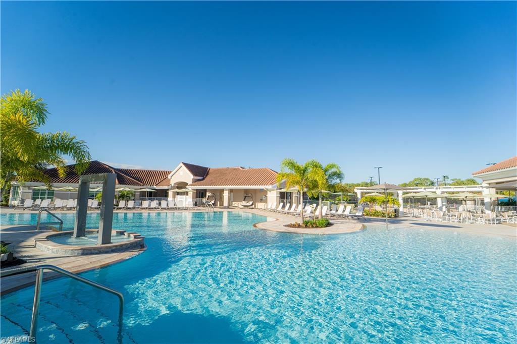 8457 Radcliffe Terrace, Unit 102 Naples, FL 34120 - Photo 32 of 33 Community pool featuring a patio area