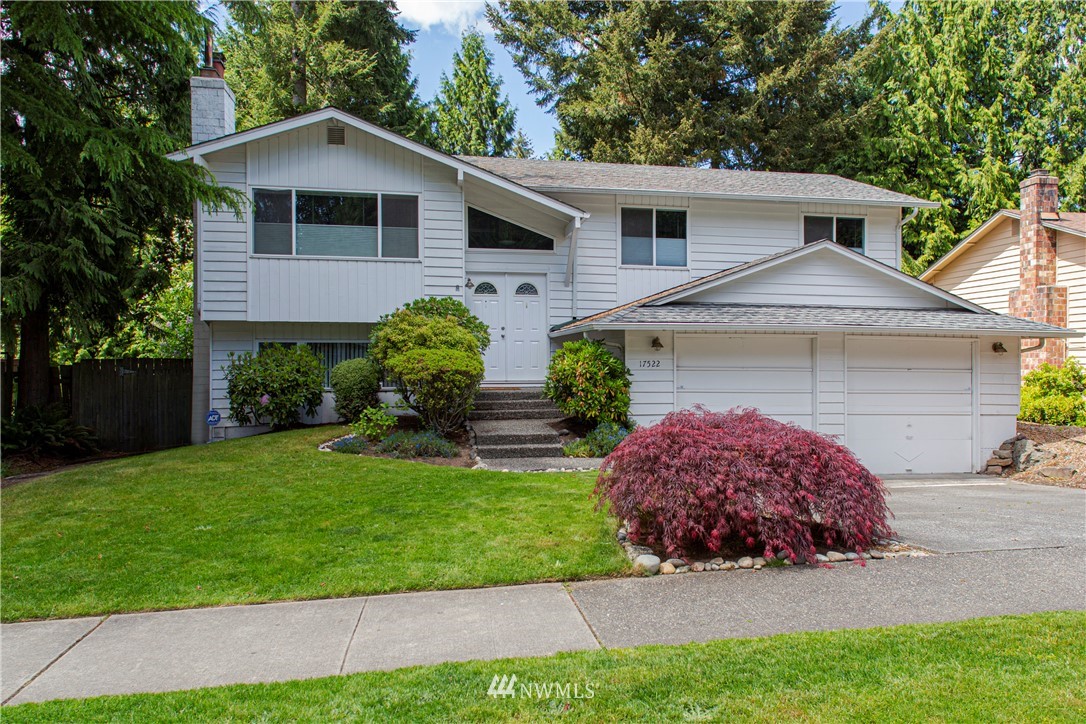 17522 Brook Boulevard Bothell, WA 98012 - Photo 1 of 35 a front view of a house with a yard and garage