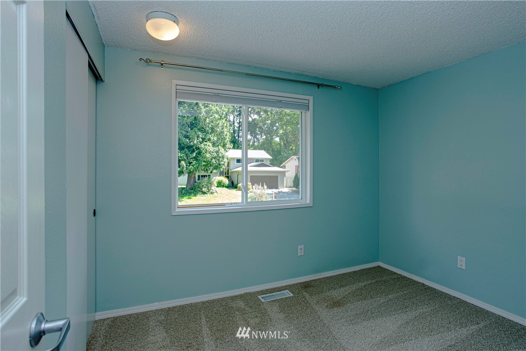 17522 Brook Boulevard Bothell, WA 98012 - Photo 7 of 35 an empty room with a window