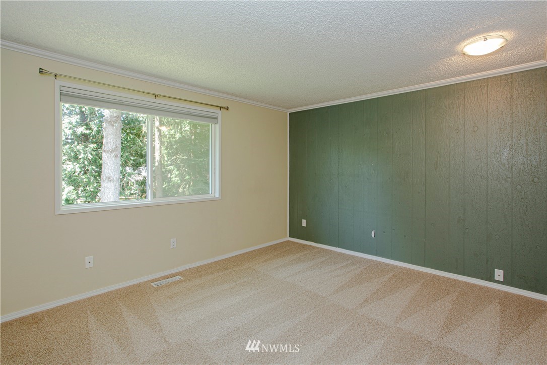 17522 Brook Boulevard Bothell, WA 98012 - Photo 9 of 35 a view of an empty room with a window
