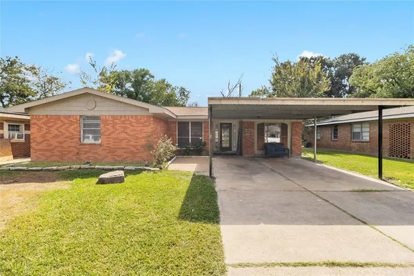 a view of a house with swimming pool and a porch
