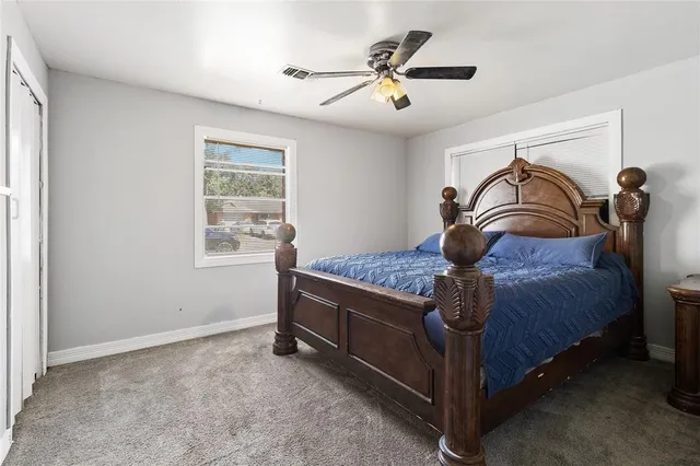 a bed sitting in a room next to a window